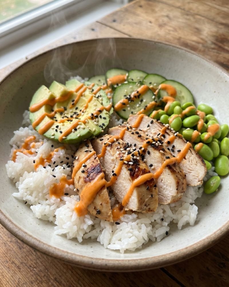 High protein girl dinner bowl with chicken rice avocado cucumbers and edamame