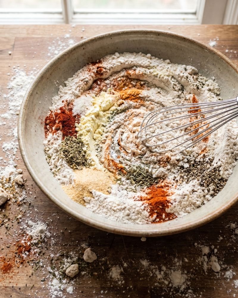 Seasoned flour coating mixture with cornstarch and spices for broasted chicken